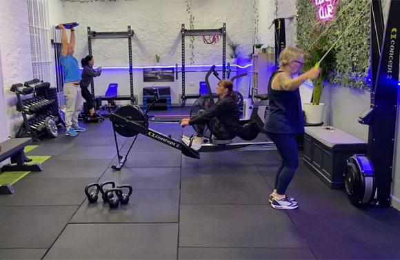 Various people performing their HIIT workouts in Holistic Fitness Club